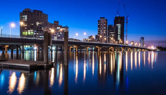 Southport city skyline at twilight with the Sundale Bridge reflected on the water